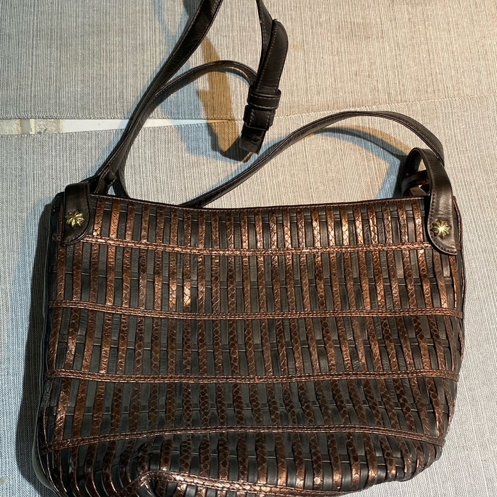 Never used brown/black purse. Made by Sharif